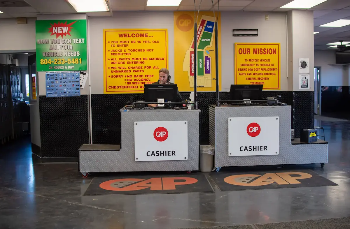 Person talking on phone at cash register